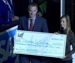 Cathy Andrade receiving DTBL check from Sharks